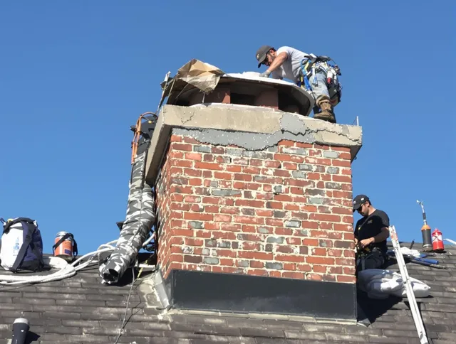 North Branford Chimney Sweep installing a custom chimney crown in North Branford, CT