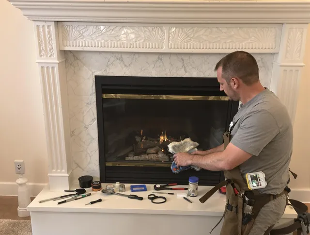 North Branford Chimney Sweep performing fireplace maintenance in North Branford, CT