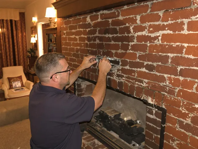 North Branford Chimney Sweep expert fixing a fireplace in North Branford, CT